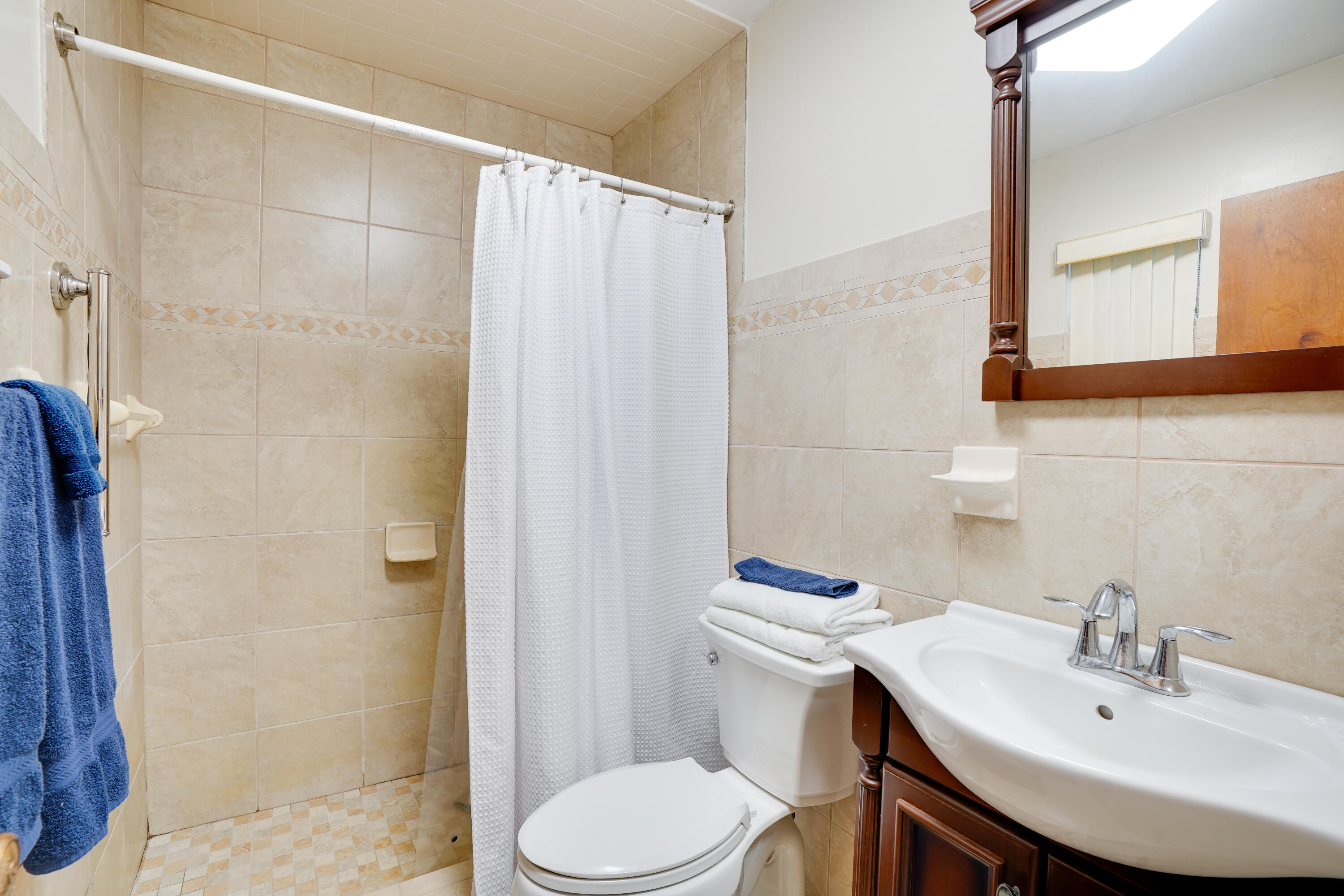 7601 Donlon Road Fort Pierce, FL 34951 - Photo 27 of 32 a bathroom with a sink a toilet and shower