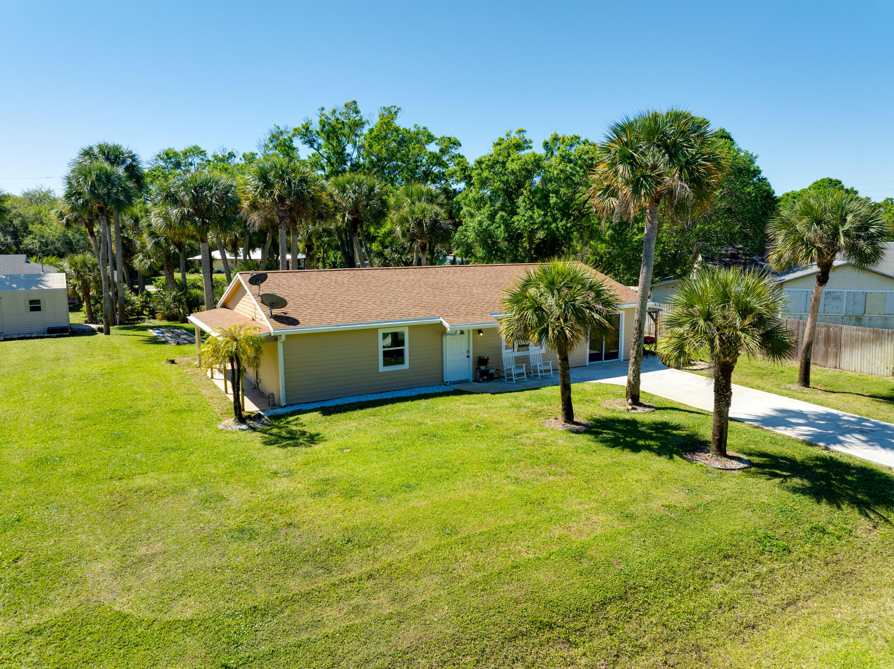 7601 Donlon Road Fort Pierce, FL 34951 - Photo 29 of 32 a view of a house with a yard