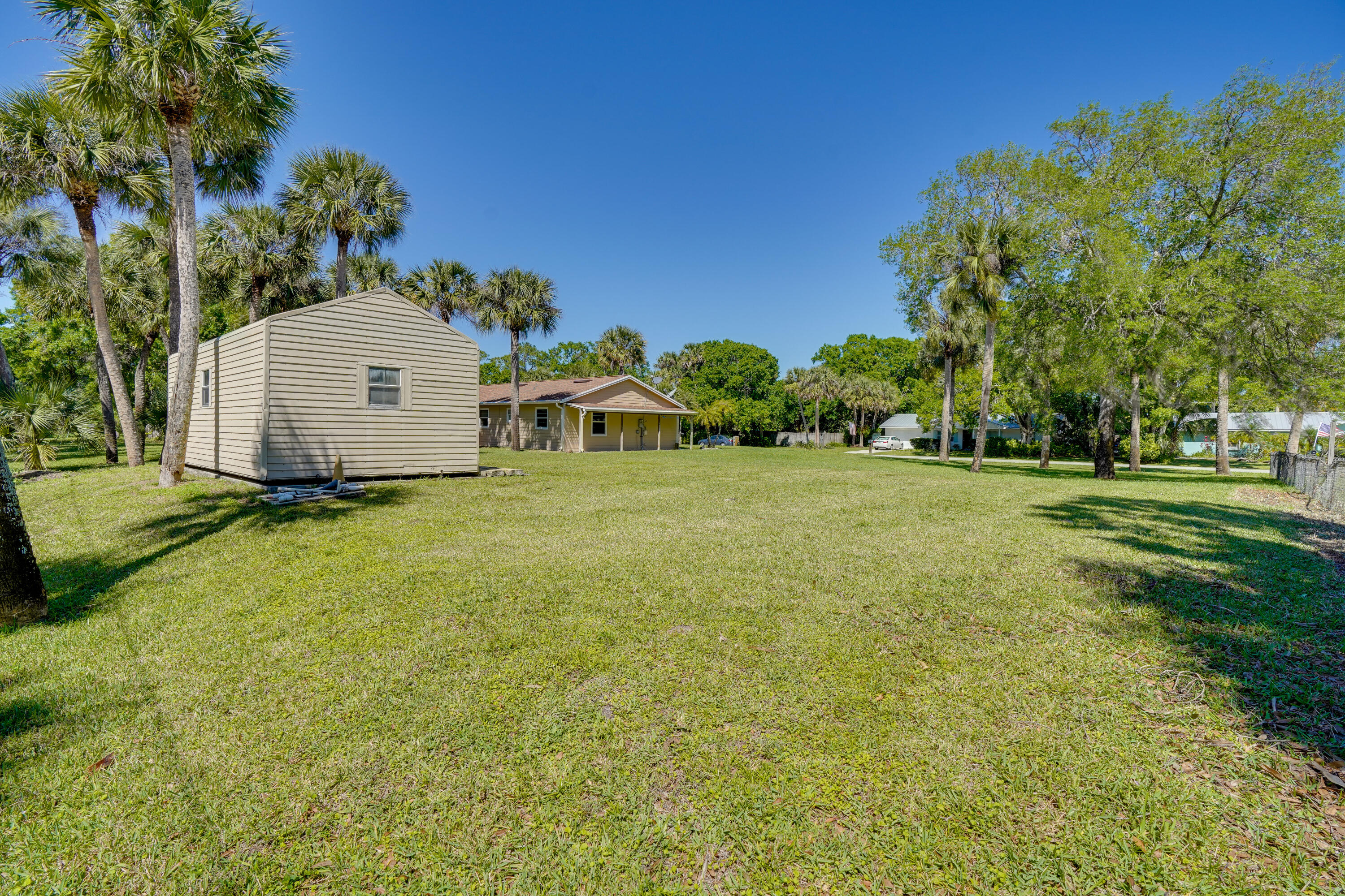7601 Donlon Road Fort Pierce, FL 34951 - Photo 7 of 32 a view of a trees with barn in the background