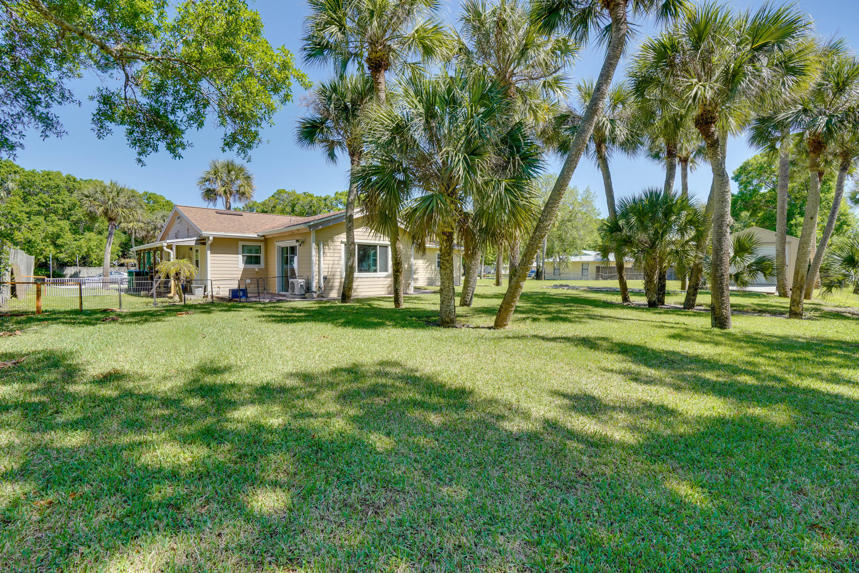 7601 Donlon Road Fort Pierce, FL 34951 - Photo 10 of 32 a front view of a house with a garden