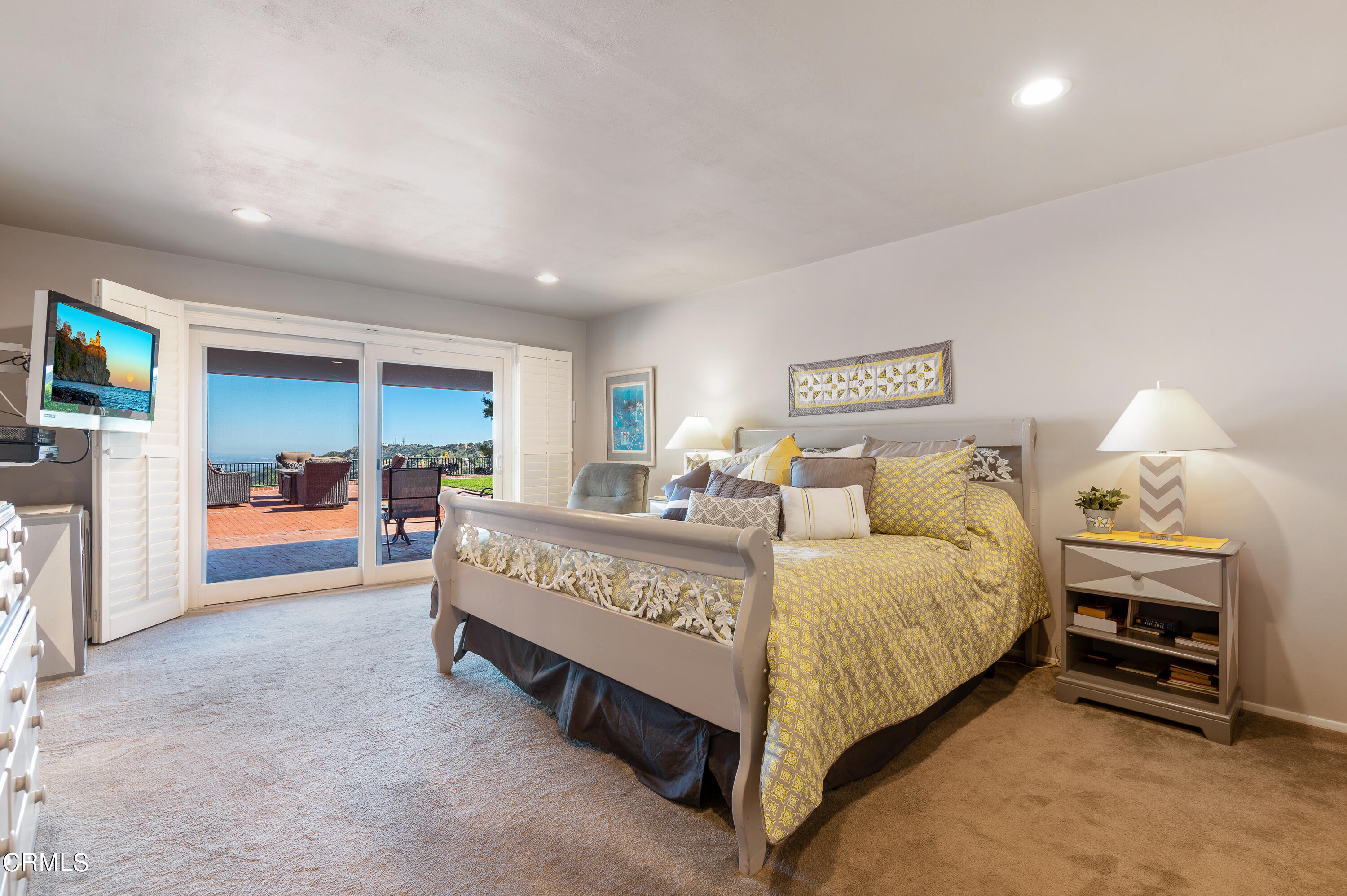 3894 San Augustine Drive Glendale, CA 91206 - Photo 16 of 51 a spacious bedroom with a bed and a view of kitchen