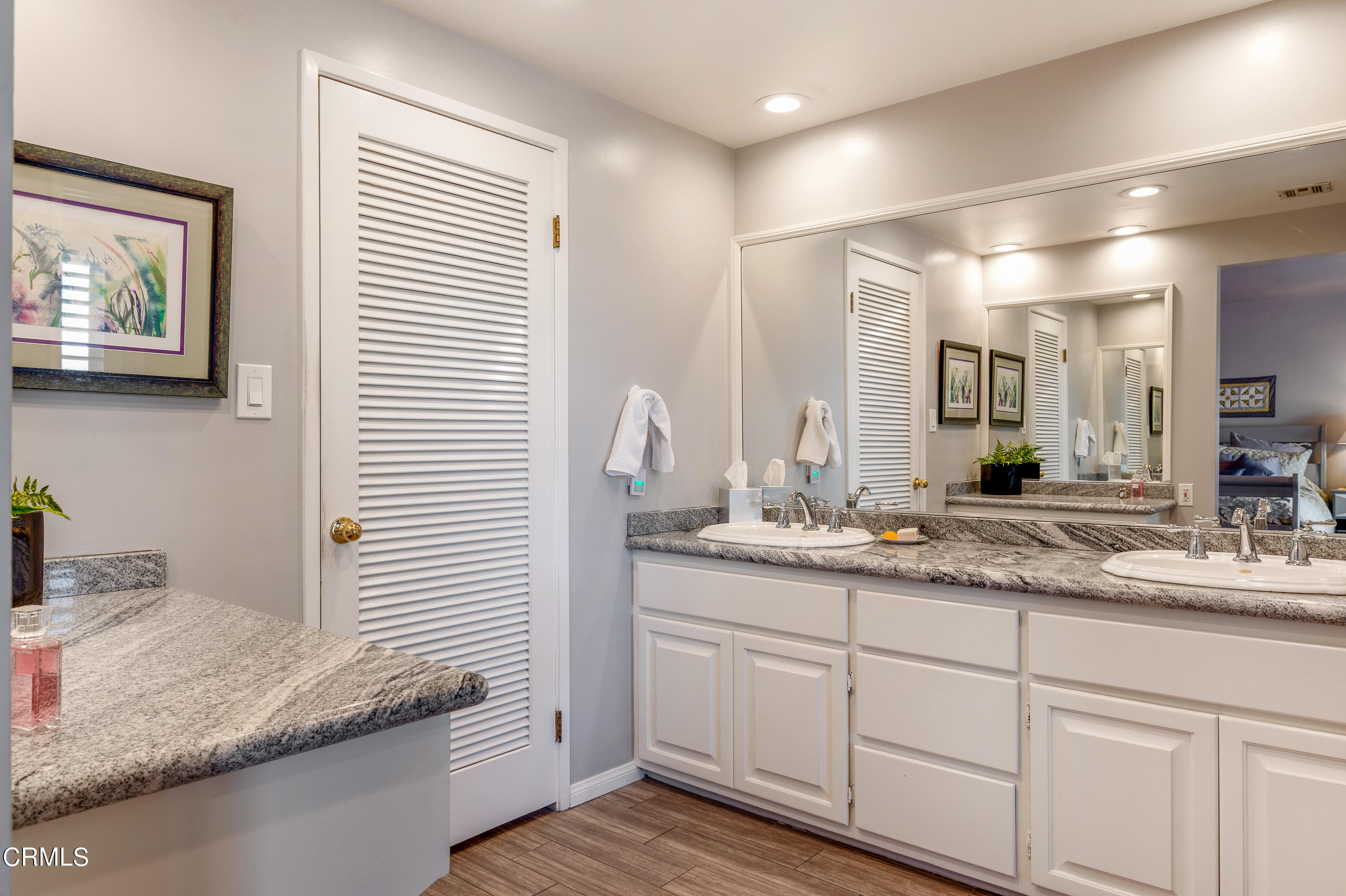 3894 San Augustine Drive Glendale, CA 91206 - Photo 18 of 51 a bathroom with a granite countertop sink and a mirror