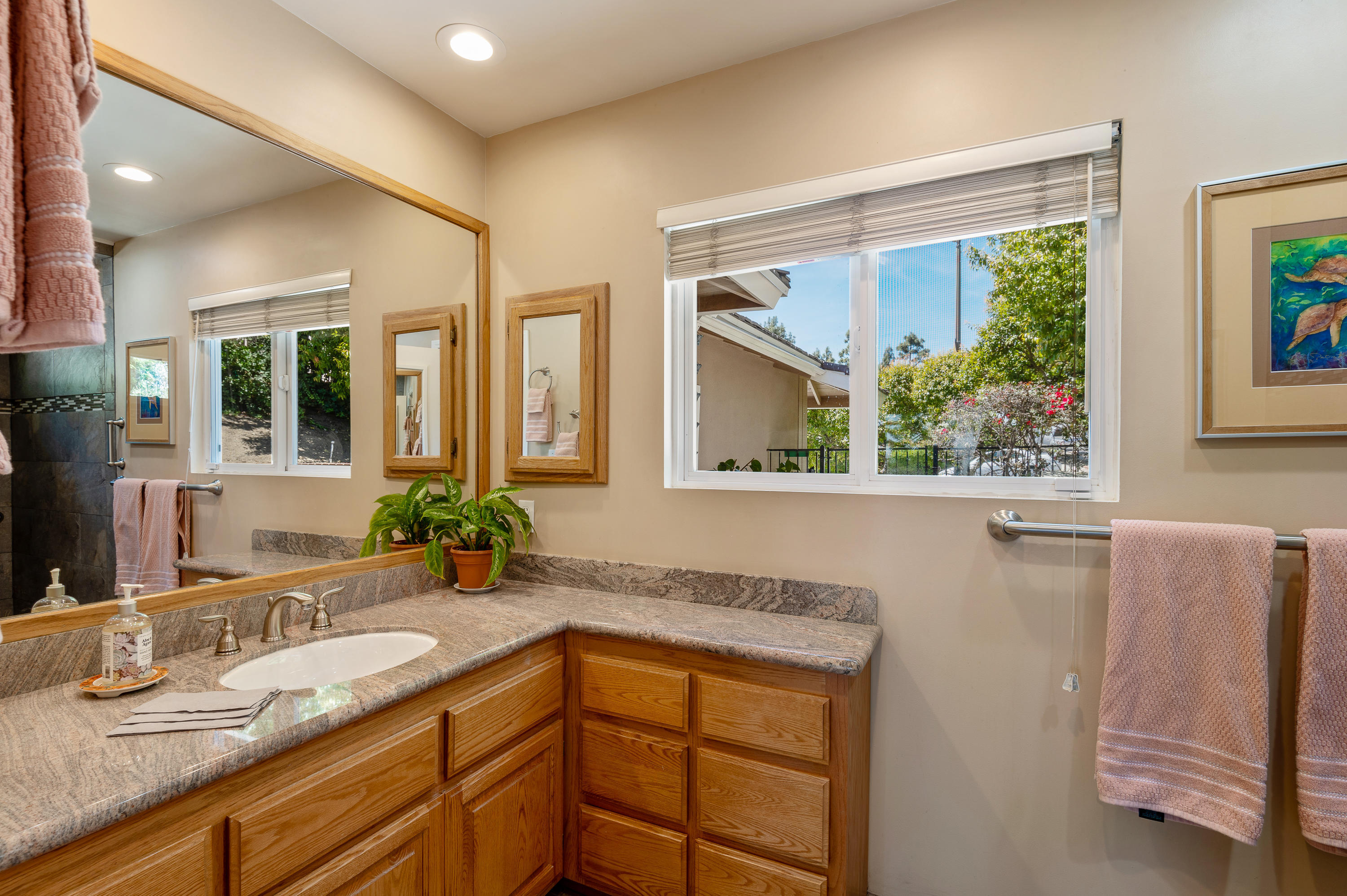 3894 San Augustine Drive Glendale, CA 91206 - Photo 23 of 51 a bathroom with a granite countertop sink mirror and window