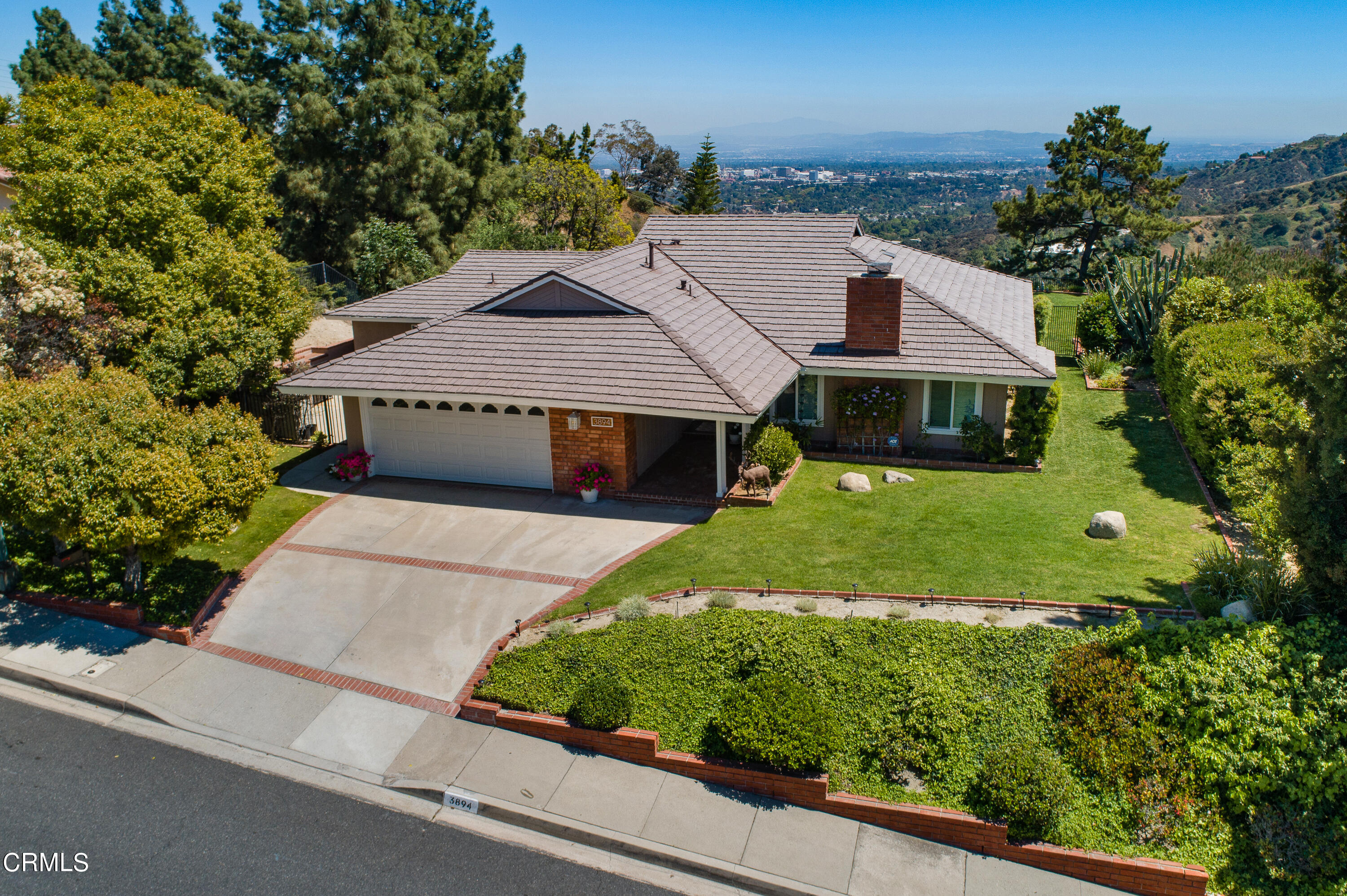 3894 San Augustine Drive Glendale, CA 91206 - Photo 34 of 51 a aerial view of a house with a yard and potted plants