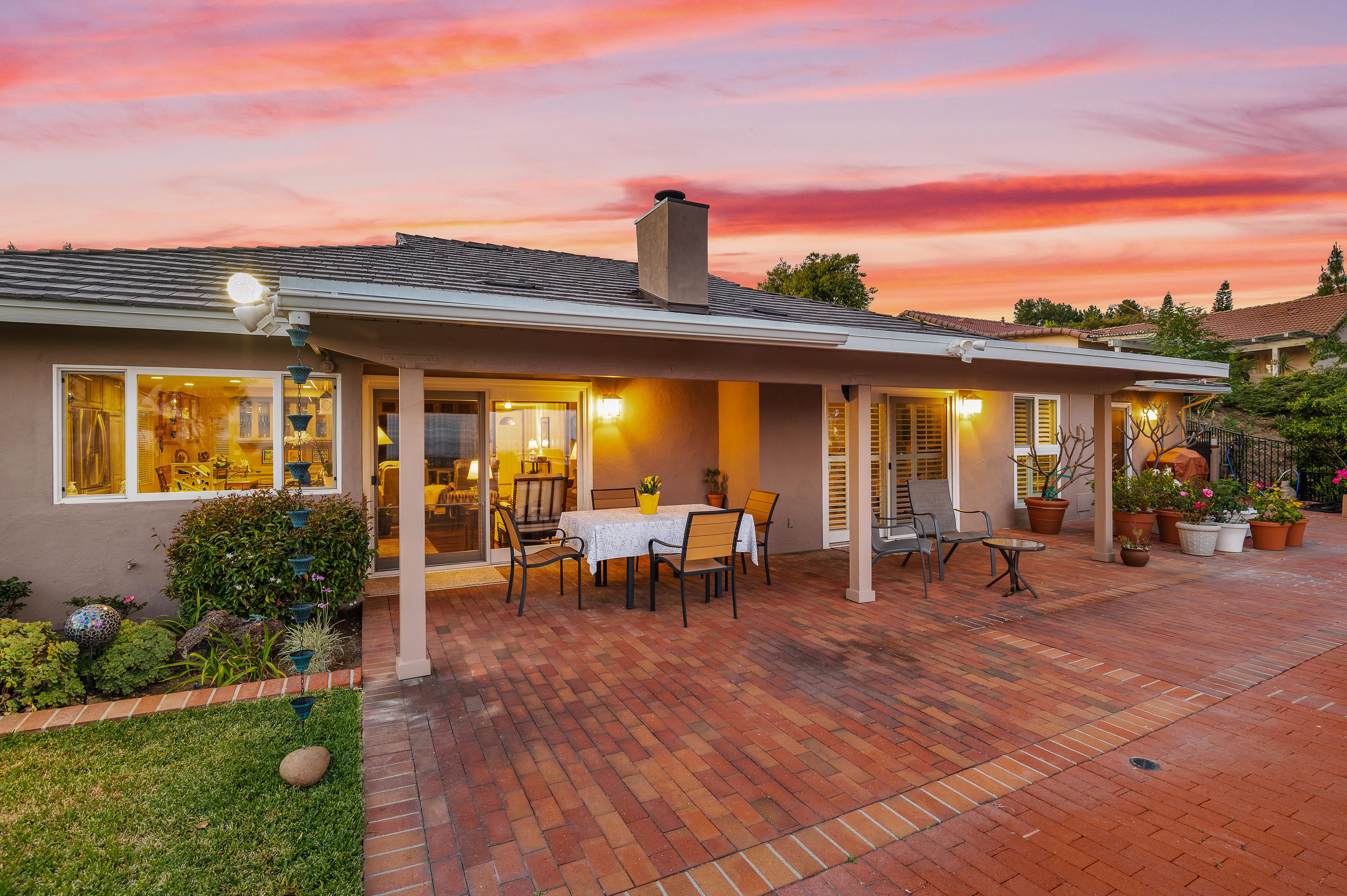 3894 San Augustine Drive Glendale, CA 91206 - Photo 48 of 51 a view of a brick house with many windows next to a yard