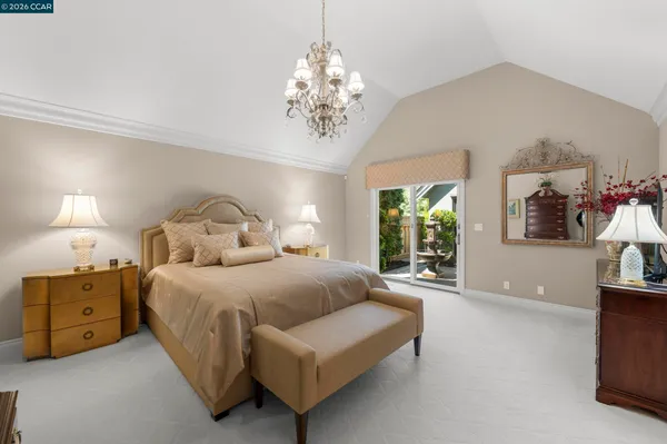 a bedroom with a bed and a couch