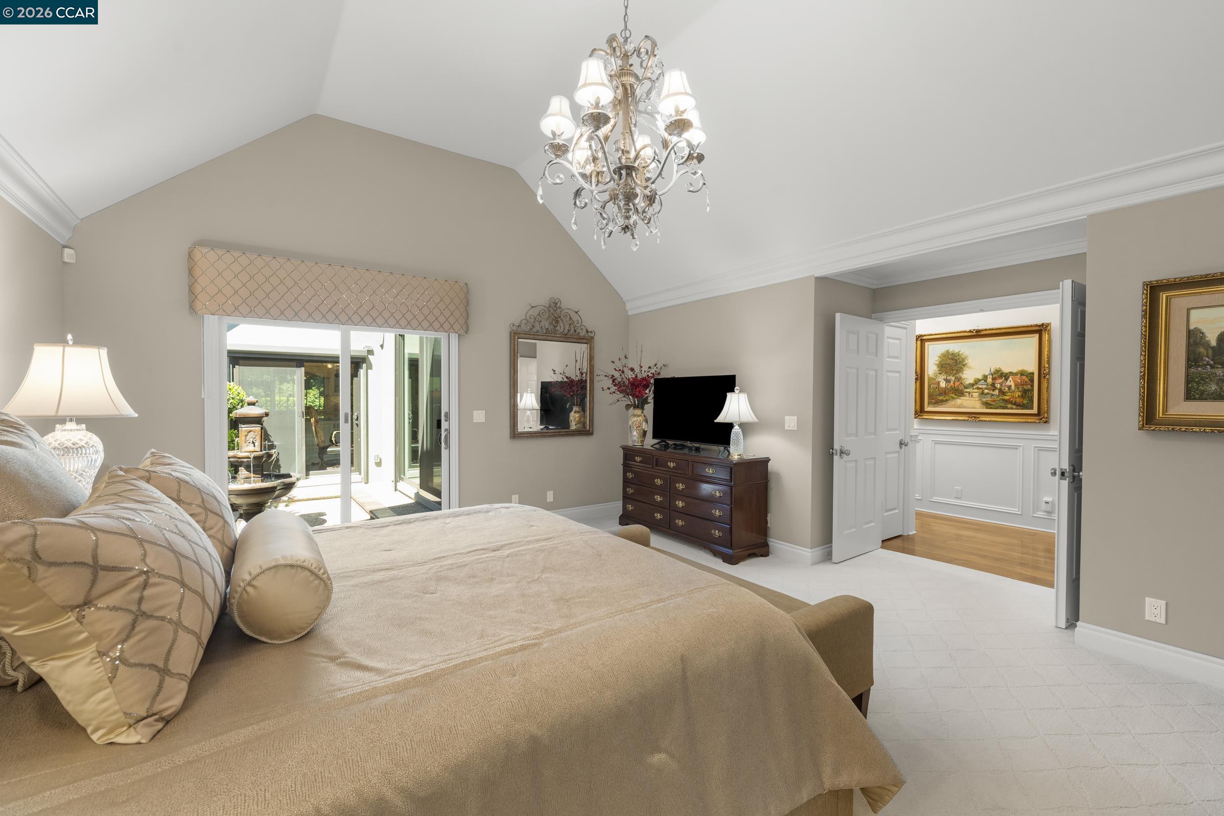 114 Golden Ridge Road Alamo, CA 94507 - Photo 20 of 60 a spacious bedroom with a bed and a flat screen tv