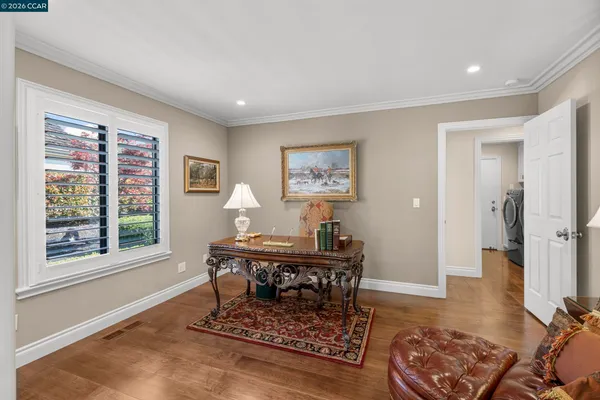 a living room with furniture and a window