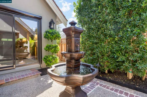 a view of a patio with couches and potted plants