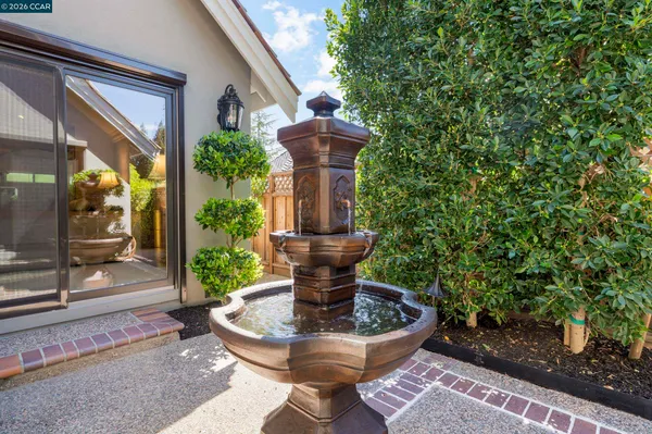 a view of a patio with couches and potted plants