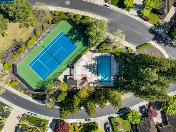 a front view of a house with a garden and patio