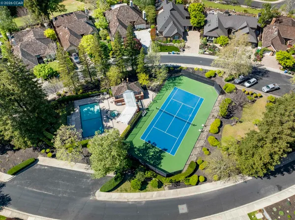 a view of a house with sitting area and garden