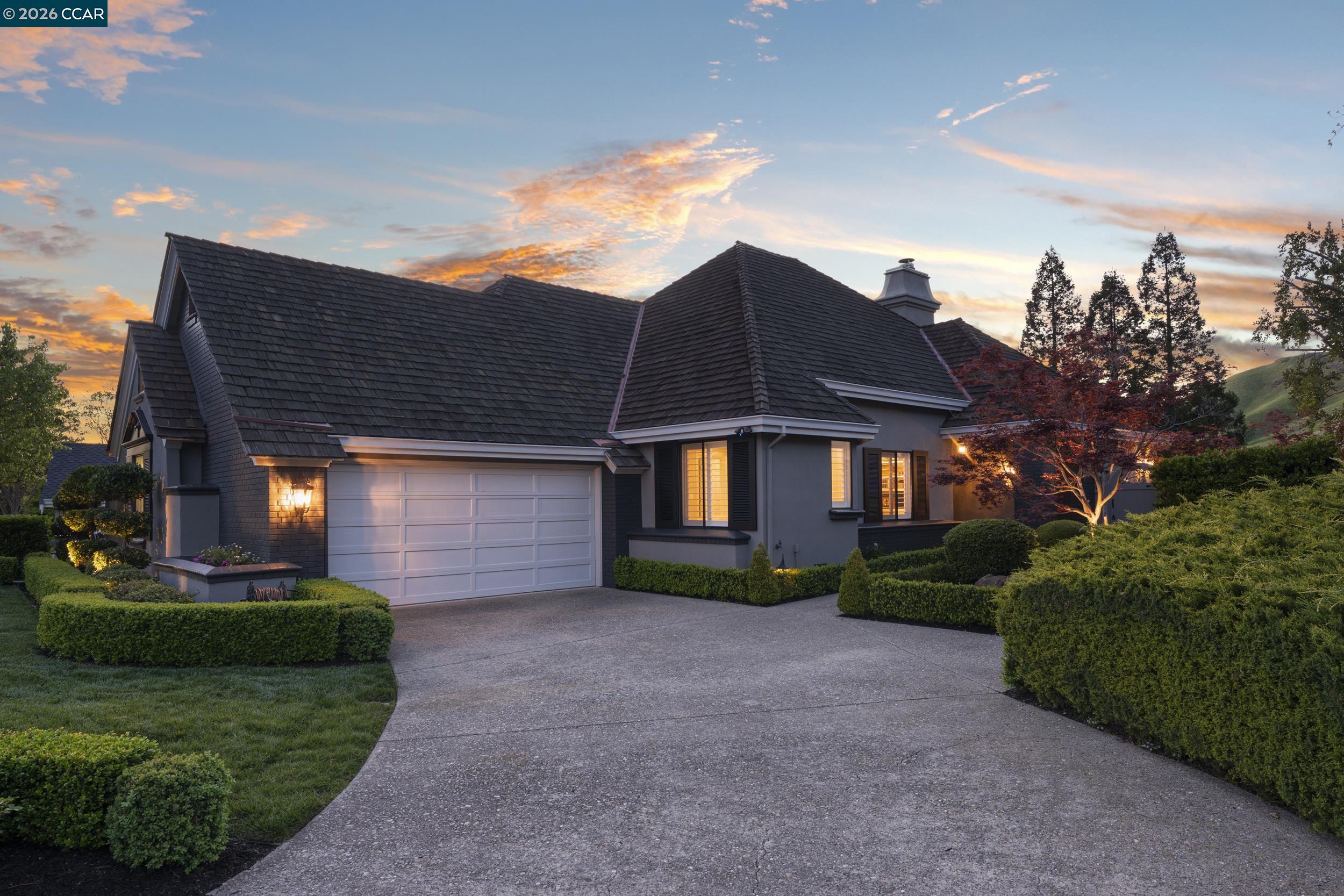 114 Golden Ridge Road Alamo, CA 94507 - Photo 52 of 60 a front view of a house with a yard and garage