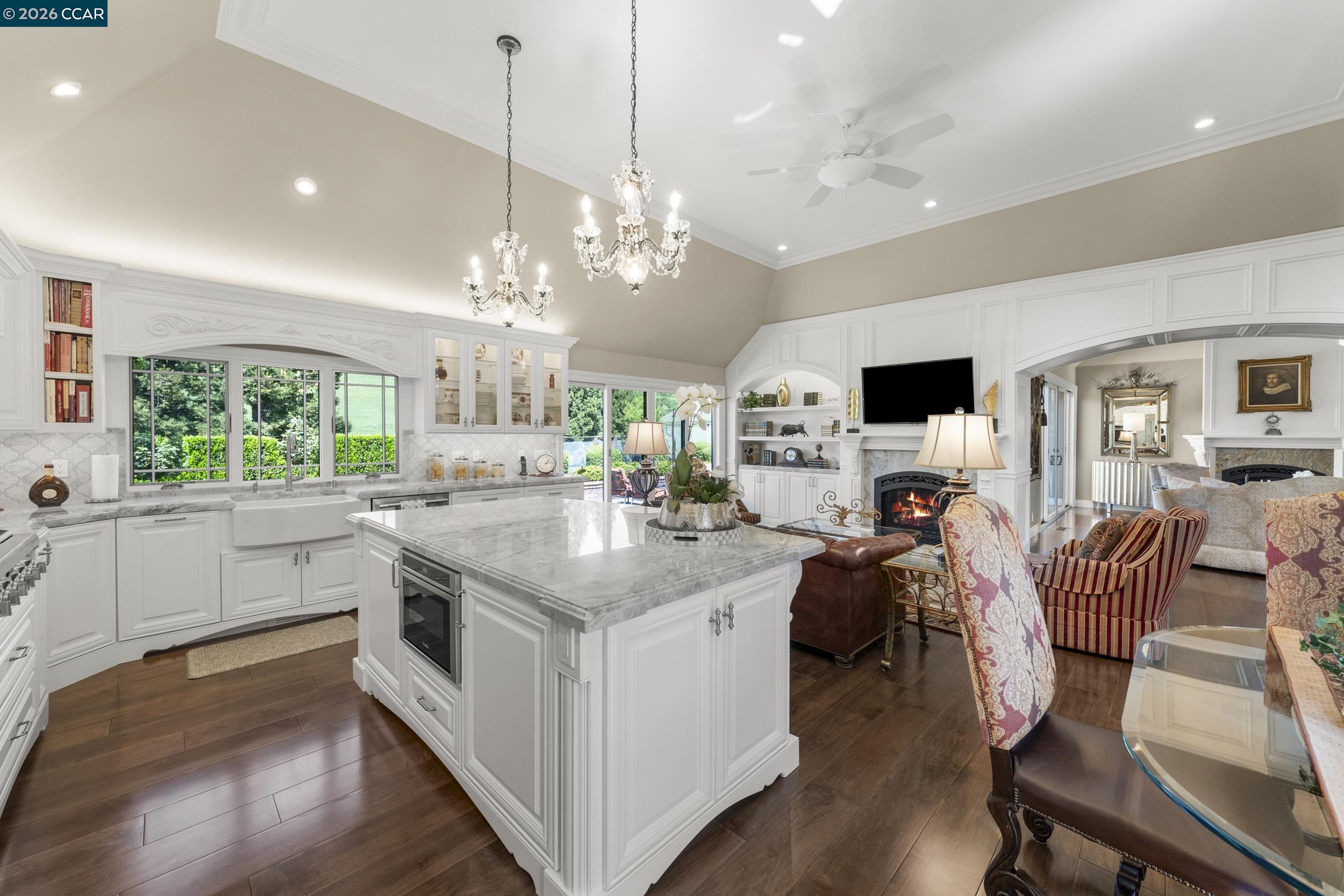 114 Golden Ridge Road Alamo, CA 94507 - Photo 9 of 60 a kitchen with stainless steel appliances kitchen island a large island in the center and wooden floor