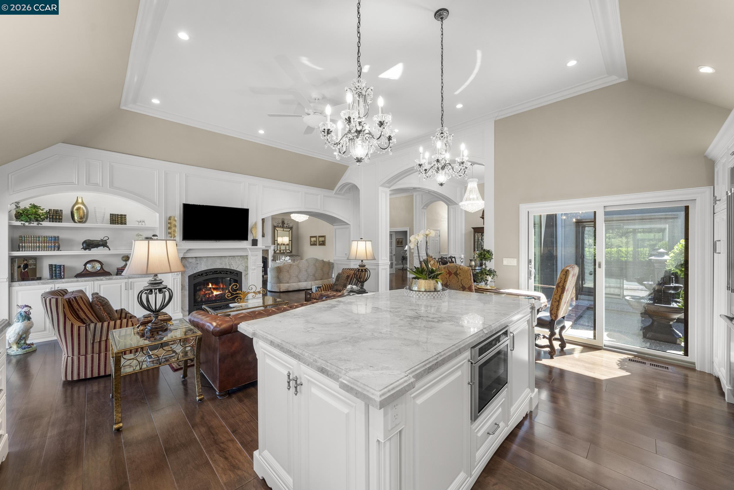 114 Golden Ridge Road Alamo, CA 94507 - Photo 10 of 60 a open kitchen with stainless steel appliances granite countertop a stove oven a dining table and chairs with wooden floor