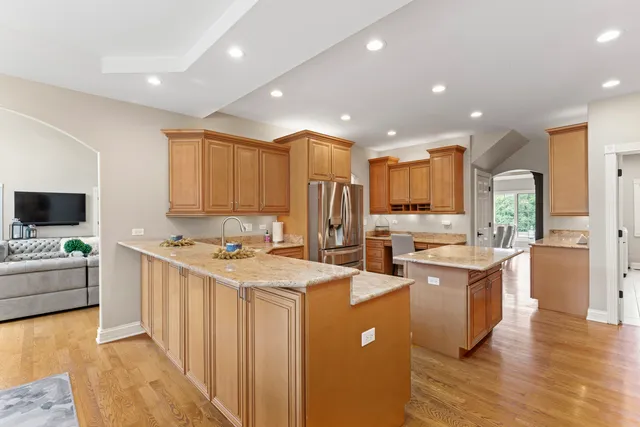 a view of a roof deck with table and chairs and wooden floor