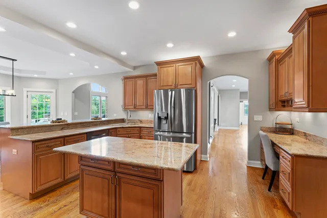 a kitchen with stainless steel appliances a sink and a microwave