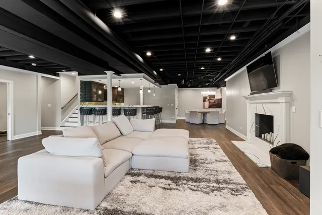 a living room with a couch and a rug