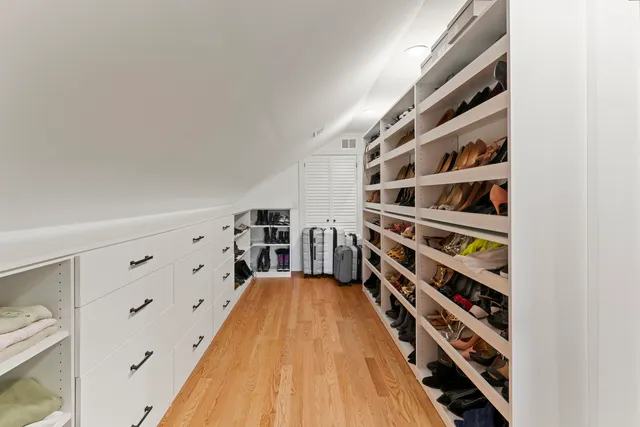 an aerial view of a house with a garden and trees