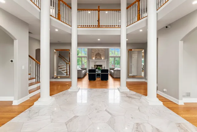 a living room with fireplace furniture and a flat screen tv