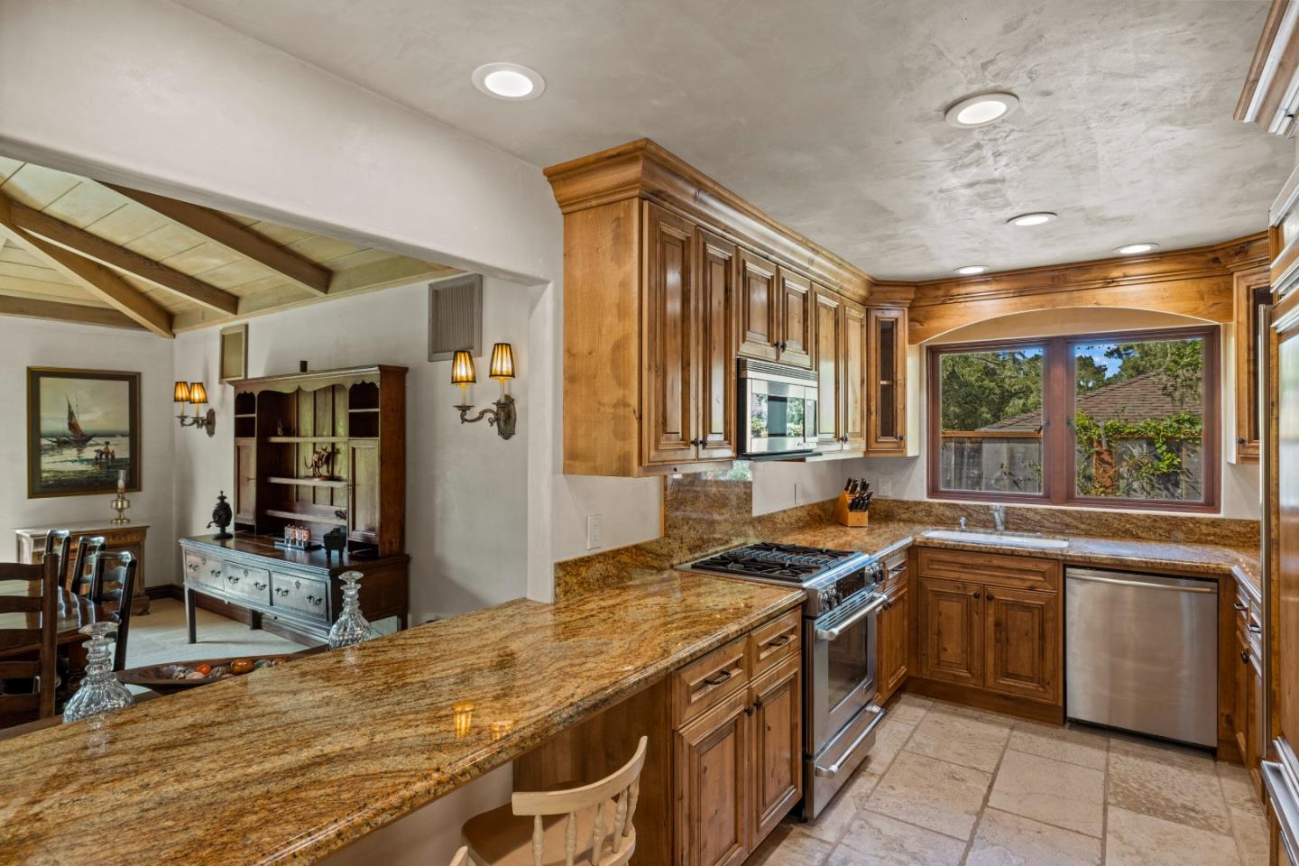 1156 Arroyo Drive Pebble Beach, CA 93953 - Photo 12 of 42 a kitchen with a sink stove and cabinets