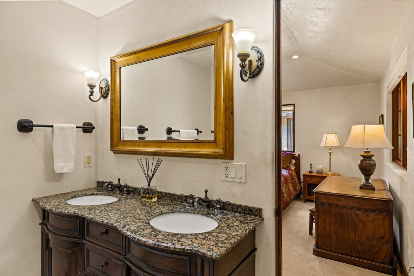 1156 Arroyo Drive Pebble Beach, CA 93953 - Photo 21 of 42 a bathroom with a sink double vanity and a mirror
