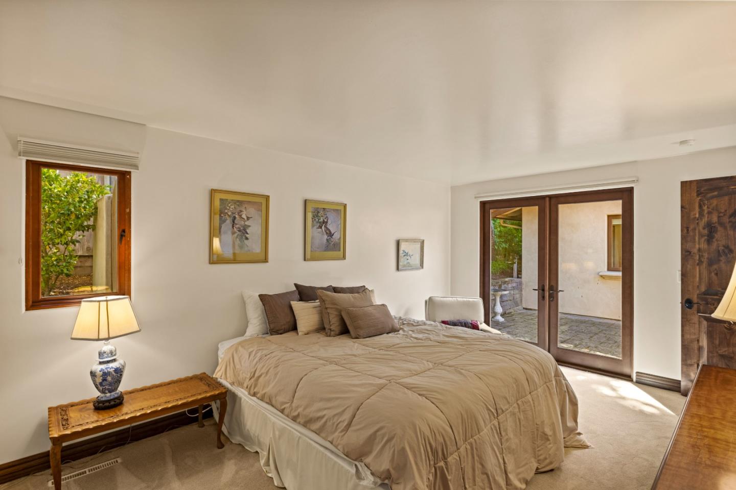 1156 Arroyo Drive Pebble Beach, CA 93953 - Photo 27 of 42 a bedroom with a bed and a window