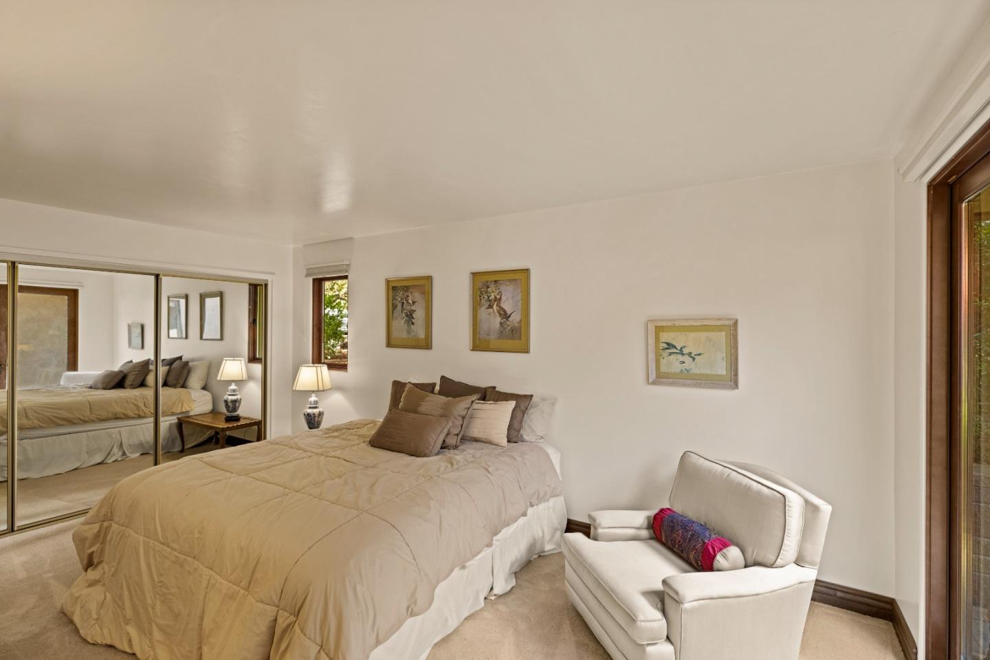 1156 Arroyo Drive Pebble Beach, CA 93953 - Photo 29 of 42 a bedroom with a bed and wooden floor