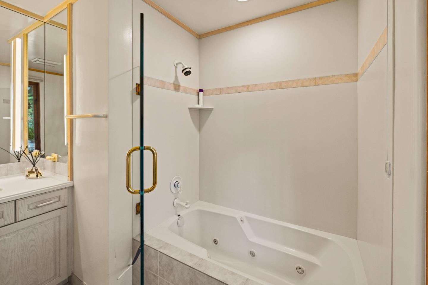 1156 Arroyo Drive Pebble Beach, CA 93953 - Photo 31 of 42 a bathroom with a tub sink vanity and mirror