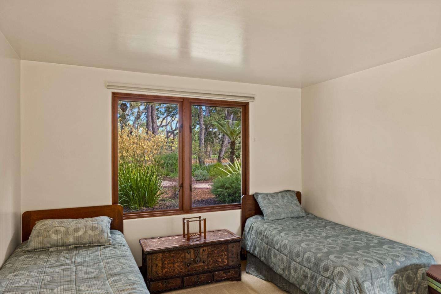 1156 Arroyo Drive Pebble Beach, CA 93953 - Photo 33 of 42 a bedroom with a bed and a window