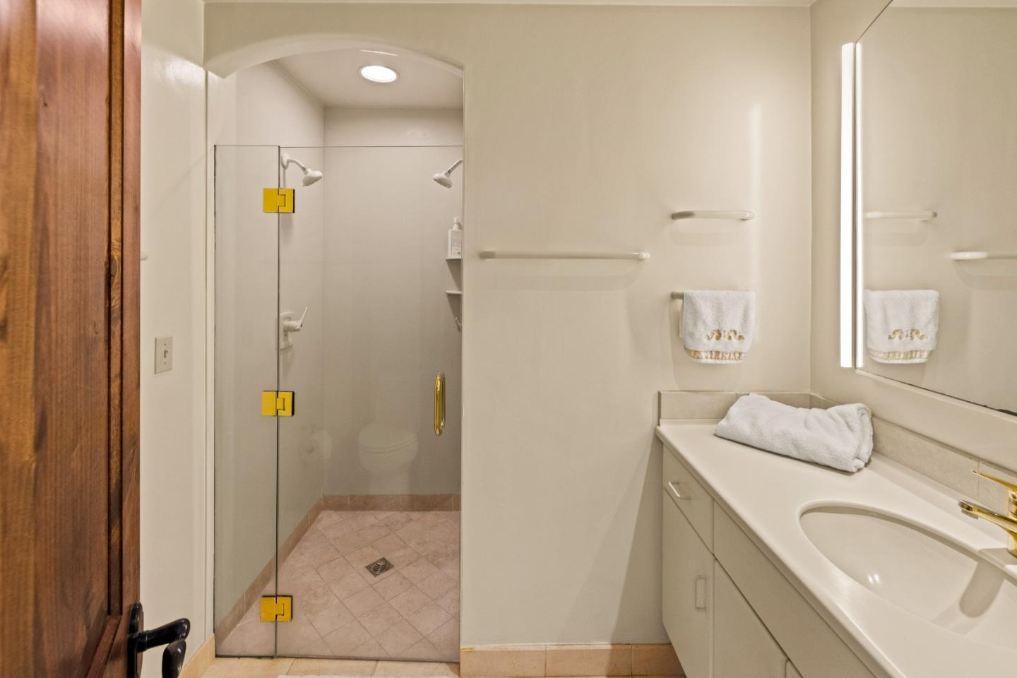 1156 Arroyo Drive Pebble Beach, CA 93953 - Photo 35 of 42 a bathroom with a sink a toilet and shower