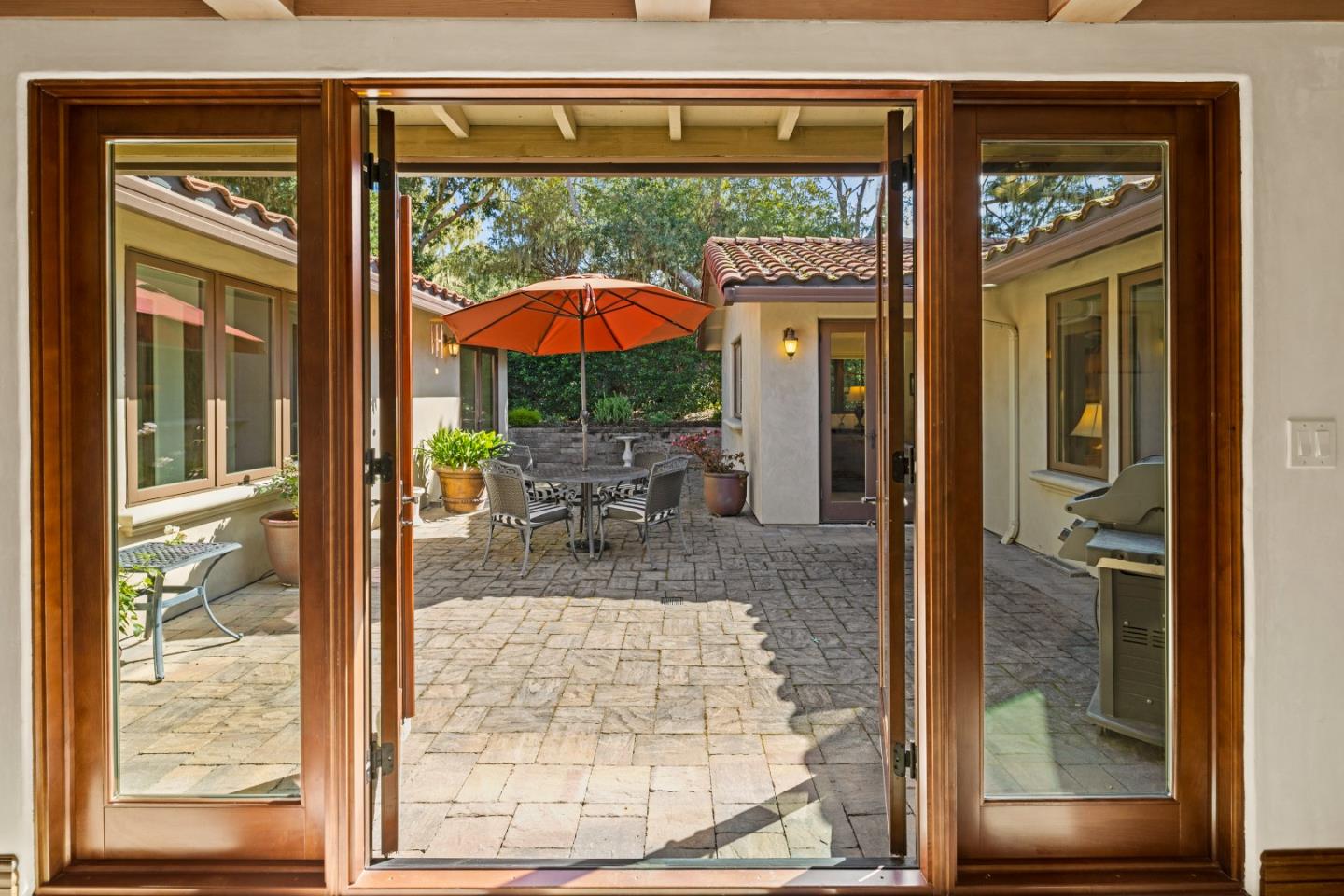 1156 Arroyo Drive Pebble Beach, CA 93953 - Photo 4 of 42 a view of a patio with a table and chairs