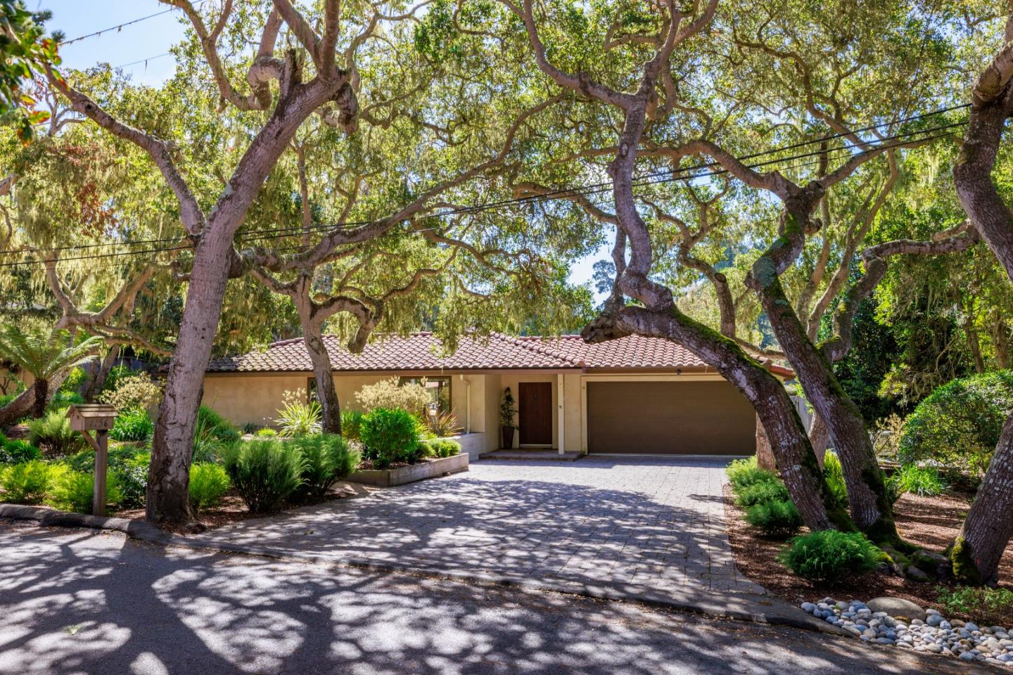 1156 Arroyo Drive Pebble Beach, CA 93953 - Photo 42 of 42 a front view of a house with garden