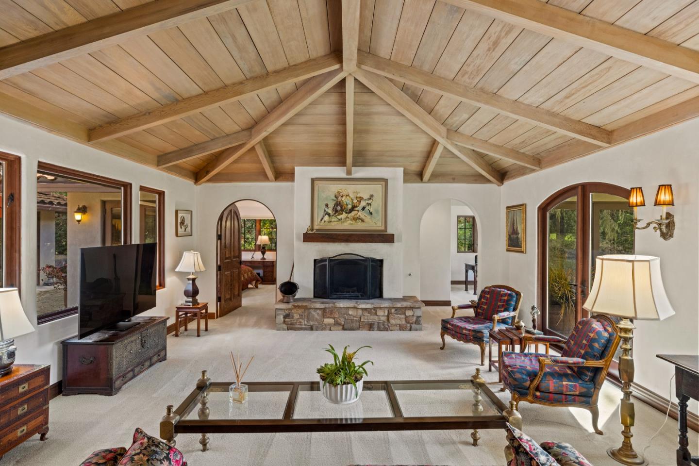 1156 Arroyo Drive Pebble Beach, CA 93953 - Photo 6 of 42 a living room with furniture a fireplace and a flat screen tv