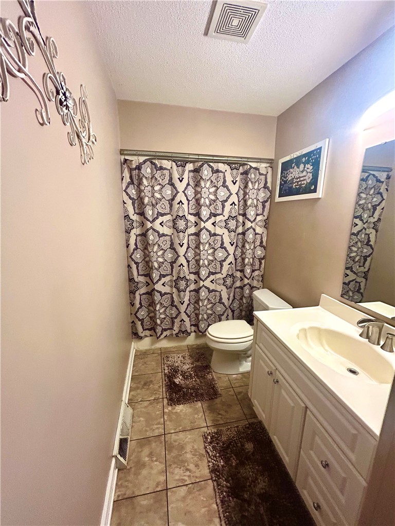 307 Mar-Mac Road Anderson, SC 29626 - Photo 9 of 19 Functional bathroom offering a single vanity and tiled flooring.