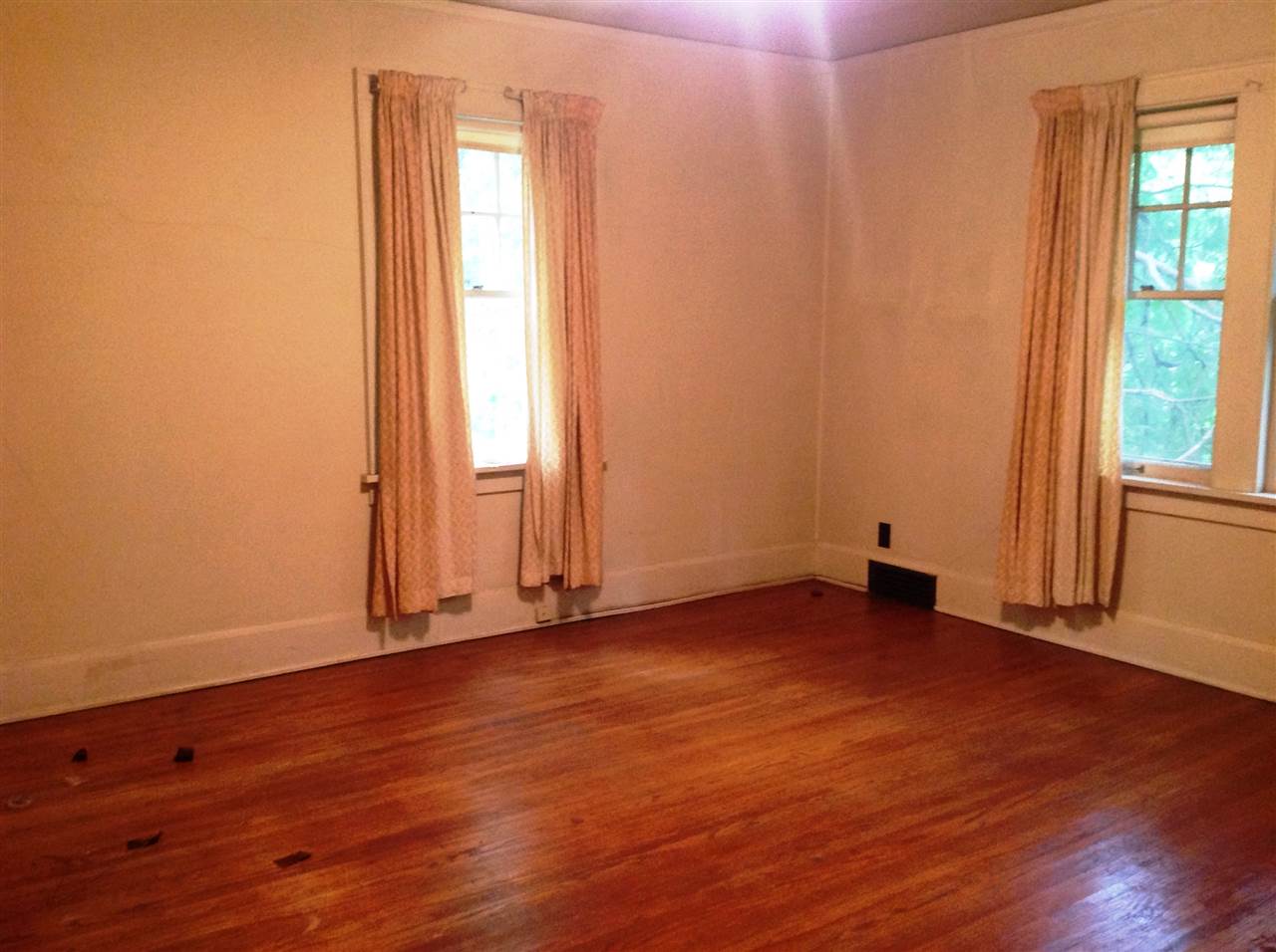 4627 Spring Brook Road Rockford, IL 61114 - Photo 18 of 19 an empty room with wooden floor and windows