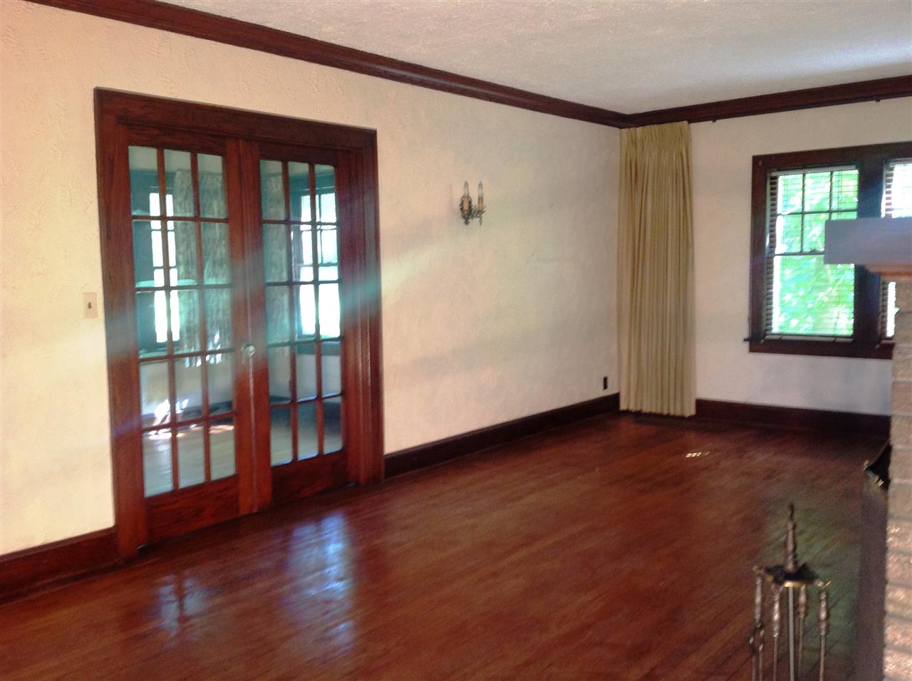 4627 Spring Brook Road Rockford, IL 61114 - Photo 9 of 19 a view of an empty room with wooden floor and a window