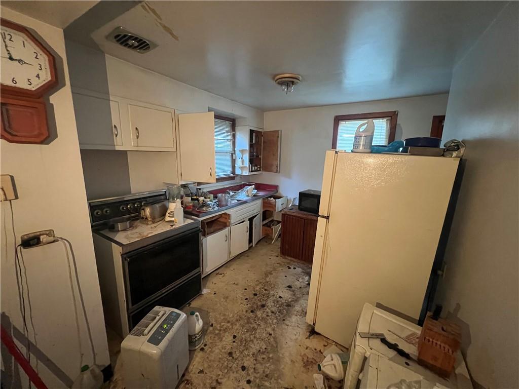 503 Main Street Leechburg, PA 15656 - Photo 11 of 20 a kitchen with sink a refrigerator and a stove