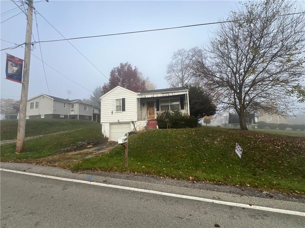 503 Main Street Leechburg, PA 15656 - Photo 2 of 20 a front view of a house with garden