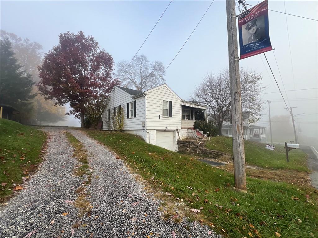 503 Main Street Leechburg, PA 15656 - Photo 5 of 20 a view of a yard in front of a house with large windows