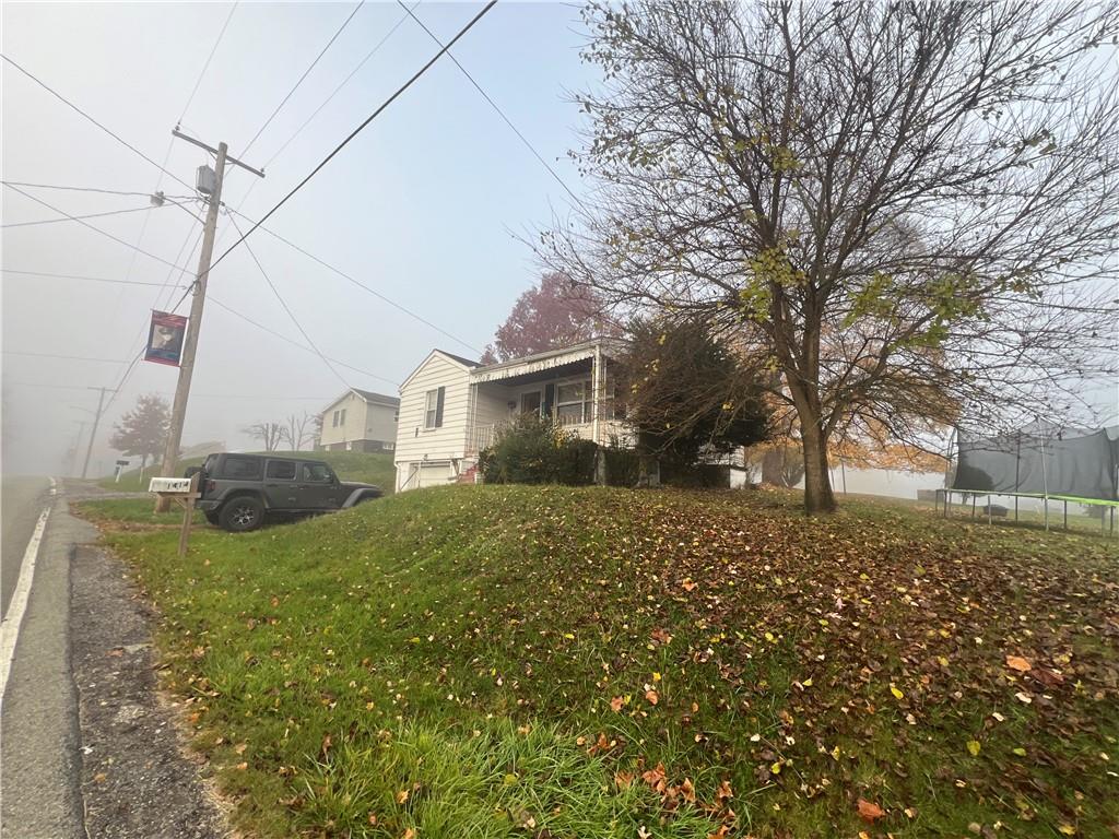 503 Main Street Leechburg, PA 15656 - Photo 6 of 20 a view of a house with a yard