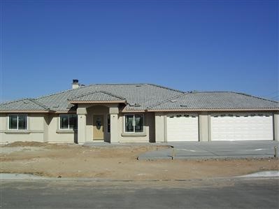 21724 Cholena Road Apple Valley, CA 92307 - Photo 1 of 1 a front view of a house