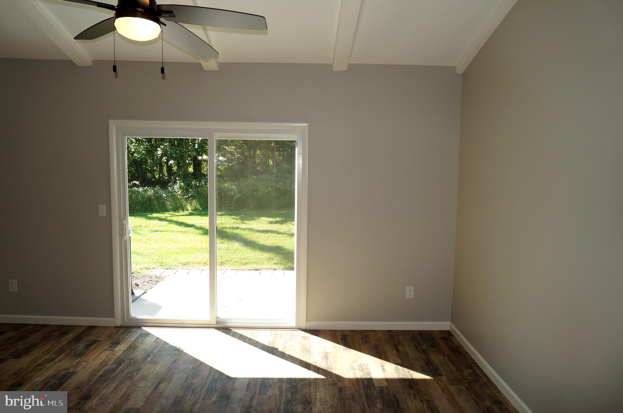 621 Range End Road, Unit 3 Dillsburg, PA 17019 - Photo 5 of 39 Living room with Rear Patio and Green Private View