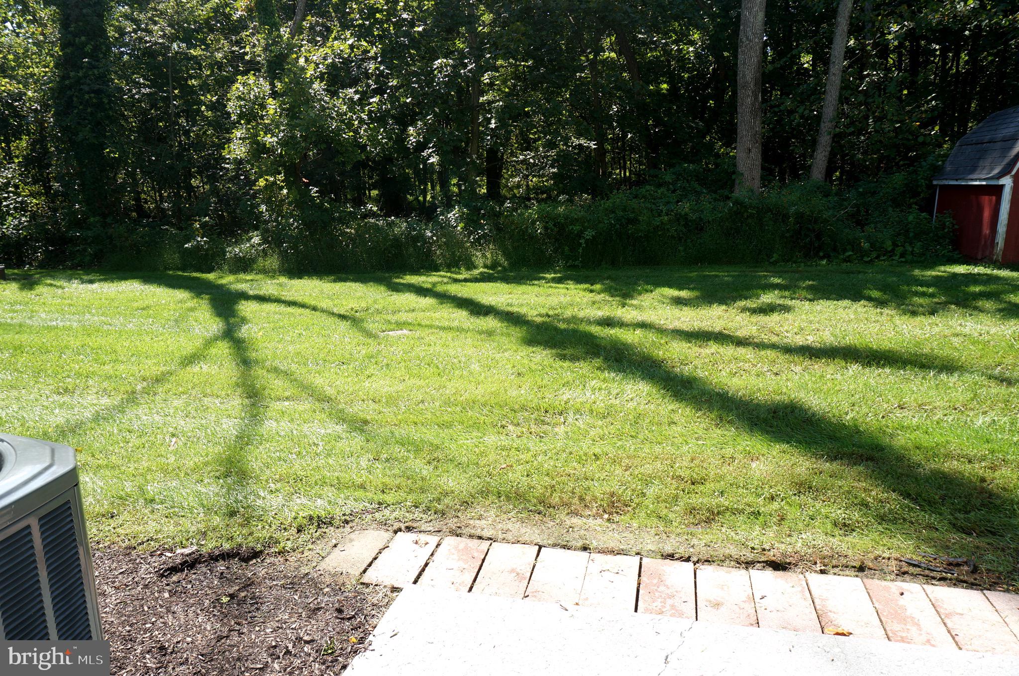 621 Range End Road, Unit 3 Dillsburg, PA 17019 - Photo 7 of 39 Rear Patio and Green Wooded View
