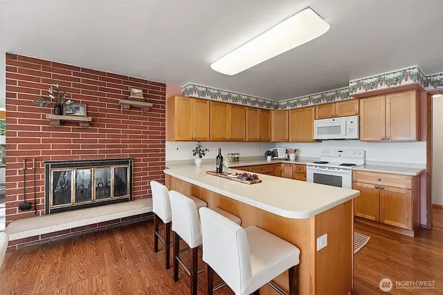 a kitchen with stainless steel appliances a stove sink and cabinets