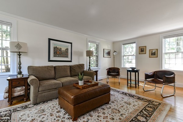 45 Earle Road Wellesley, MA 02481 - Photo 7 of 16 a living room with furniture a rug a window and a lamp
