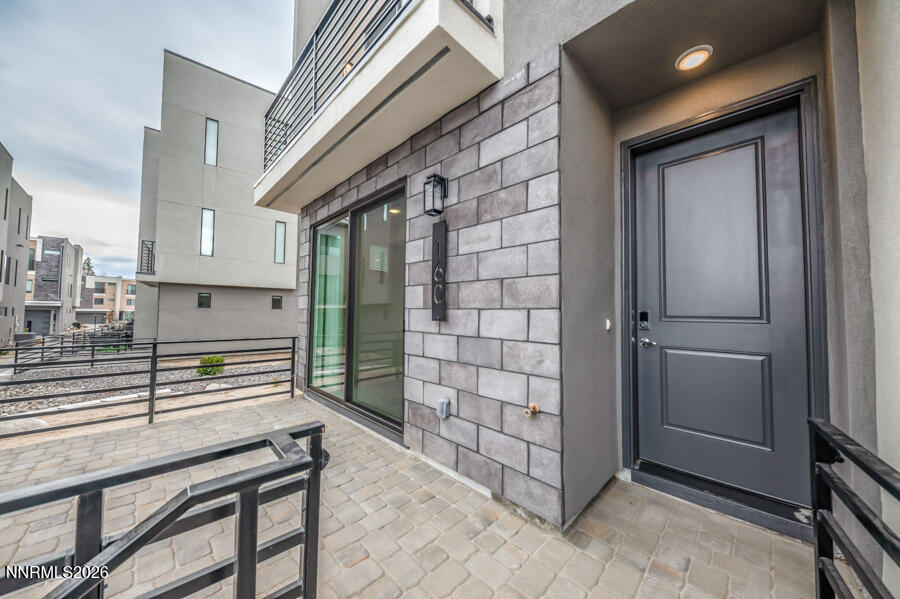 160 Rissone Lane, Unit 32 Reno, NV 89503 - Photo 4 of 5 a view of a door and chair in the balcony