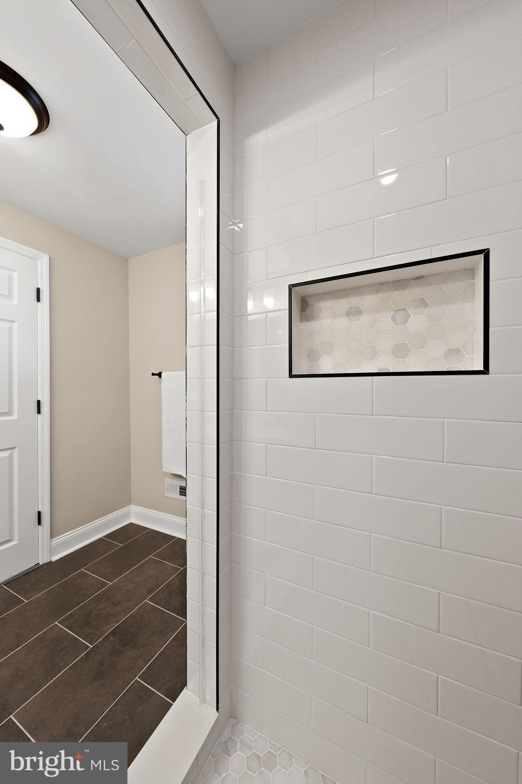 925 Union Landing Road Cinnaminson, NJ 08077 - Photo 20 of 42 Sleek modern shower with elegant tiles.