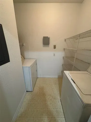 view of a storage and utility room with a sink