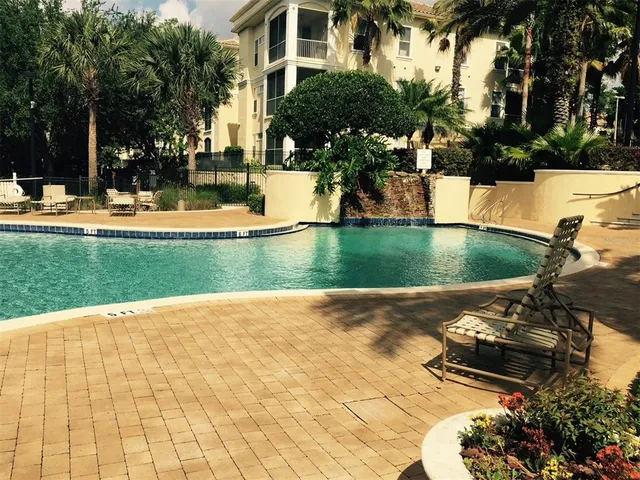a view of a swimming pool with a patio